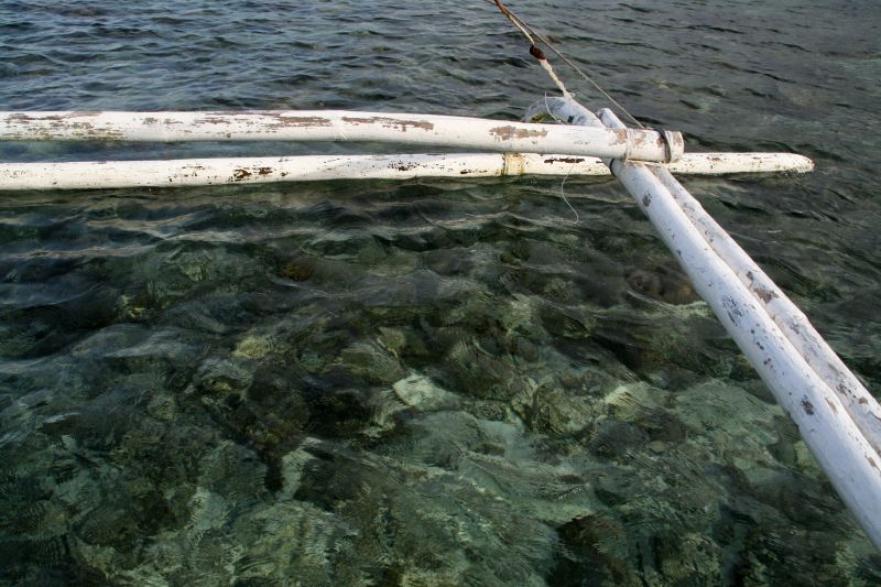 With the fishing boat over the reef