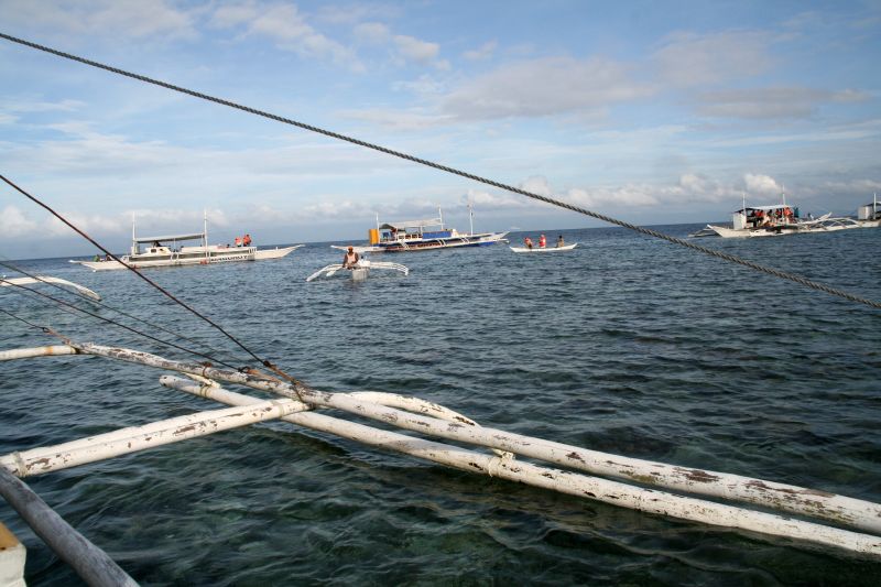 With the fishing boat over the reef