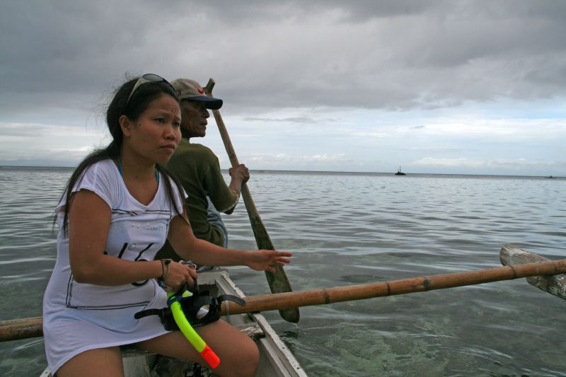 With the fishing boat over the reef